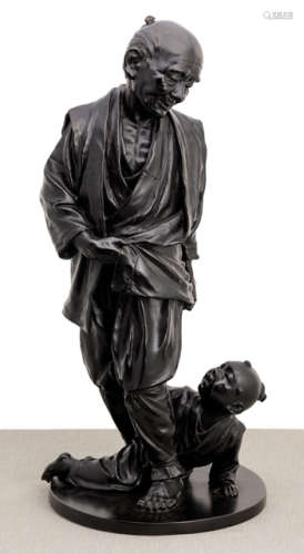 A BRONZE SCULPTURE OF AN OLD STANDING PEASANT MAN WITH A YOUNG BOY