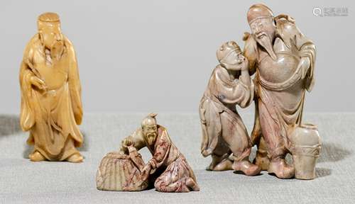 A GROUP OF THREE CARVED SOPASTONE FIGURES