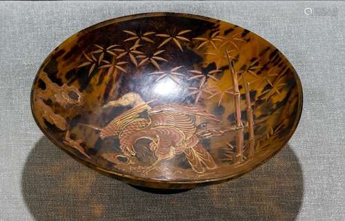 A TORTOISE-SHELL FOOTED BOWL WITH GOLD LACQUER DECORATION OF A BIRD OF PREY PERCHED ON ROCKS AND BAMBOO