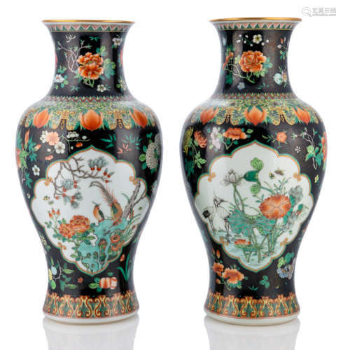 A PAIR OF FAMILLE NOIRE PORCELAIN VASES DEPICTING FLOWERS AND BIRDS IN RESERVES