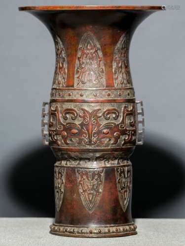 A BRONZE VASE WITH ARCHAIC DESIGNS AND TAOTIE MASKS