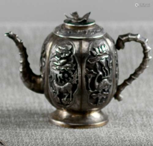A SMALL SILVER ALLOY WINE EWER AND COVER