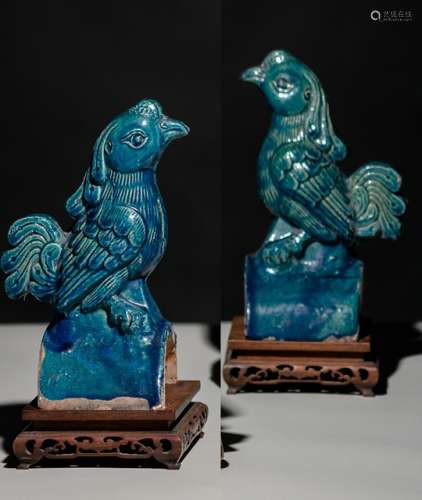 A PAIR OF TURQUOISE-GLAZED PHOENIX-SHAPED ROOF TILES