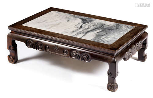 A LOW HARDWOOD TABLE WITH A MARBLE TOP