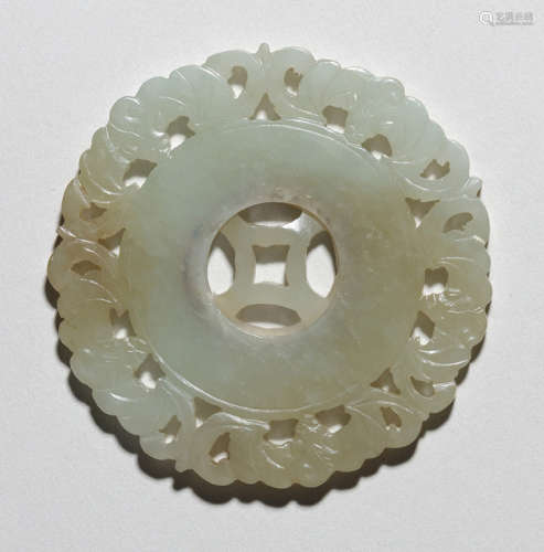 A CARVED JADE PENDANT WITH ROTATING INNER DISC