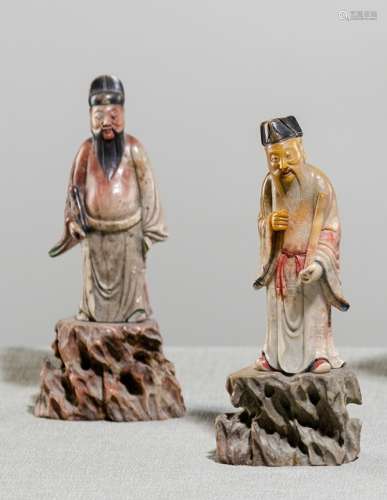A PAIR OF SOAPSTONE FIGURES ON ROCK BASES