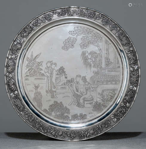 A ROUND SILVER 'LADIES IN THE GARDEN' TRAY