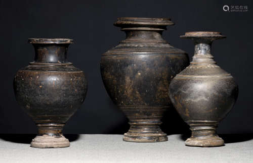 THREE DARK-BROWN GLAZED STONEWARE VESSELS