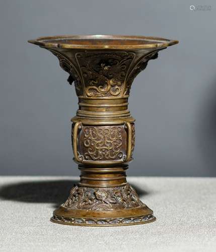 A BRONZE VASE DECORATED WITH DRAGONS