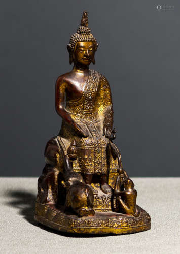 A GILT- AND BLACK-LACQUERED BRONZE FIGURE OF BUDDHA SHAKYAMUNI
