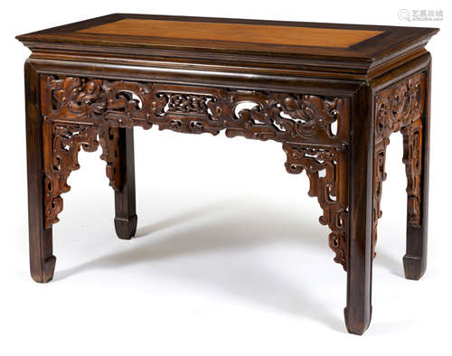 A CARVED WOOD TABLE