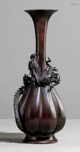 A NARROW NECK BRONZE VASE DECORATED WITH AN APPLIED SWIRLING DRAGON