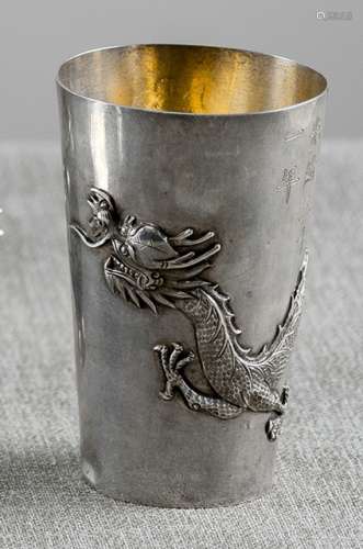 A SILVER BEAKER WITH DRAGON IN RELIEF