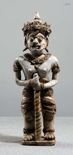 A GLAZED EARTHENWARE FIGURE OF A GUARDIAN