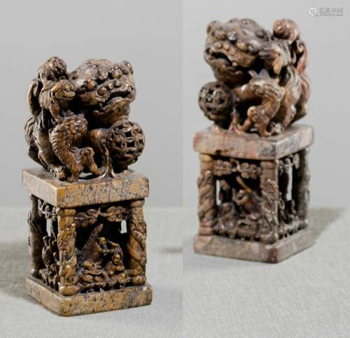 A PAIR OF LARGE SOAPSTONE SEALS IN THE SHAPE OF FO-LIONS ON PEDESTALS