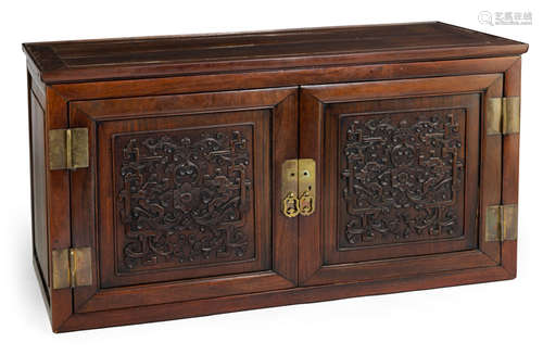 A FINE CARVED HARDWOOD TOP OF A CABINET