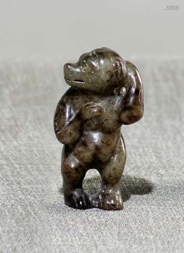 A JADE CARVING OF A STANDING BEAR
