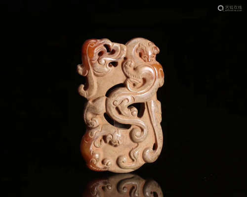 A JADE CARVED DRAGON PATTERN