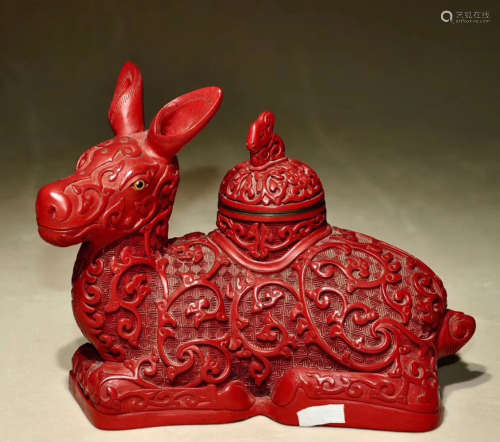 A DEER SHAPED RED LACQUER ORNAMENT