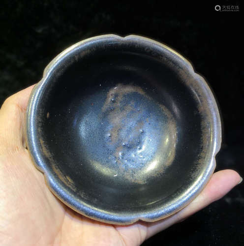 A BLACK YAO ZHOU PLATE WITH CRACK