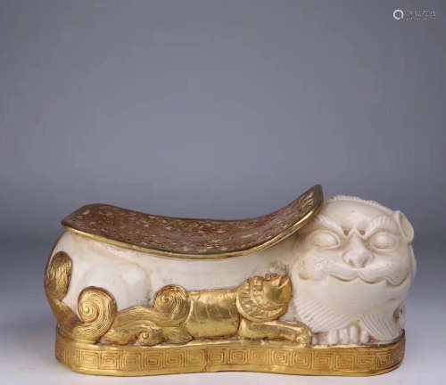 10-12TH CNETURY, AN IMPERIAL DING KILN GILT BRONZE LION DESIGN WHITE GLAZED PILLOW, SONG DYNASTY