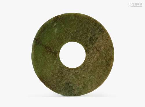 A Chinese dark green jade disc, Bi