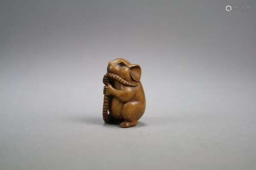 A Japanese Carved Wood Netsuke of a Rat