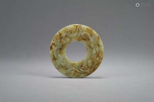 A Chinese pale green jade 'chilong' disc, Bi