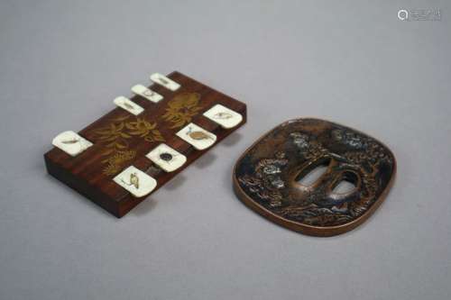 A Japanese Bronze Tsuba and a Game Marker