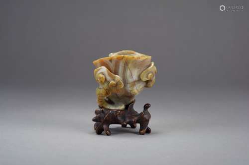 A Chinese carved red and grey agate lotus brush washer