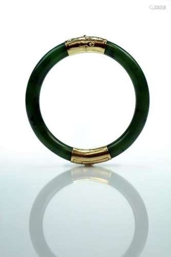 A Chinese Nephrite Jade and Gold Bangle