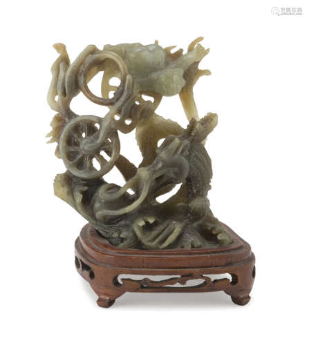 A CHINESE SERPENTINE SCULPTURE, 20TH CENTURY. representing a dragon surrounded by mighty flames