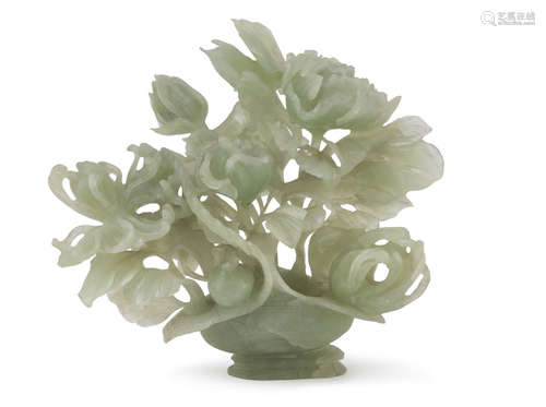 A CHINESE SERPENTINE SCULPTURE, 20TH CENTURY. representing a composition in vase with peony,