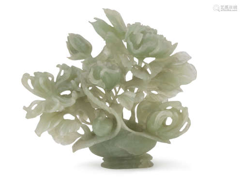 A CHINESE SERPENTINE SCULPTURE, 20TH CENTURY. representing a composition in vase with peony,