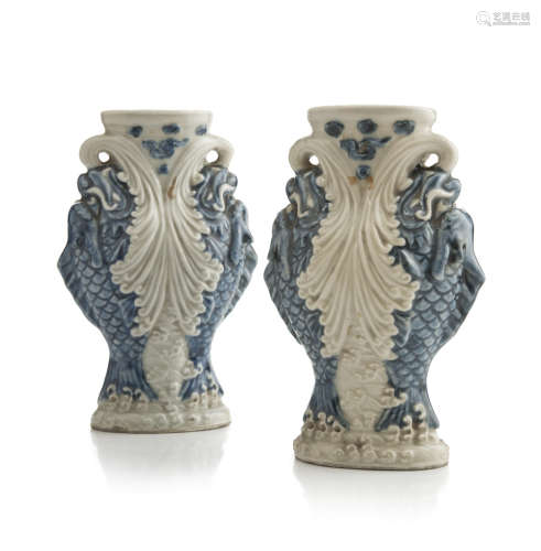A pair of Chinese white and blue porcelain vases, first half 20th century. Marked 'Da Qing