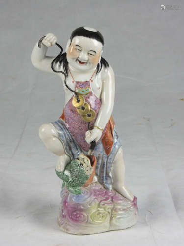 A Chinese polychrome porcelain sculpture, depicting Liu Hai. First half 20th century. Measures cm.