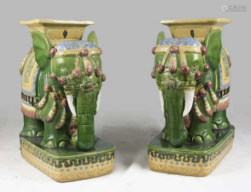 A pair of Chinese polychrome ceramic seats, depicting elephants. 20th century. Measures cm. 57 x