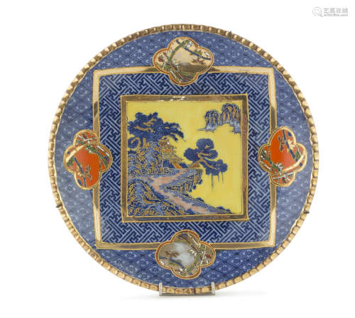 A JAPANESE POLYCHROME PORCELAIN DISH, 20TH CENTURY. decorated with landscape and bamboo and symbolic