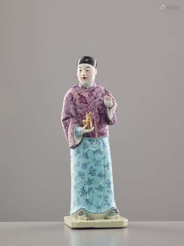 A FAMILLE ROSE FIGURE OF A MANCHU MAN WIT OPIUM PIPE, L…