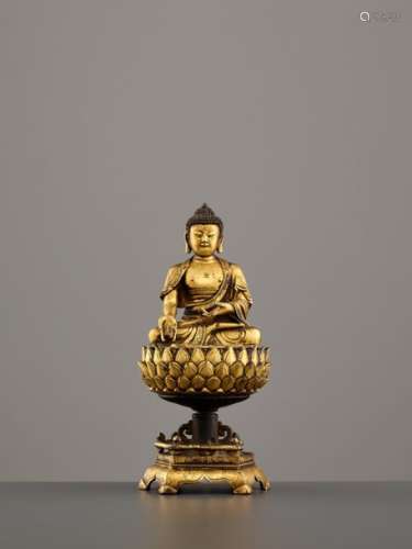 AN IMPORTANT GILT MING BRONZE FIGURE OF BUDDHA, 16th CE…