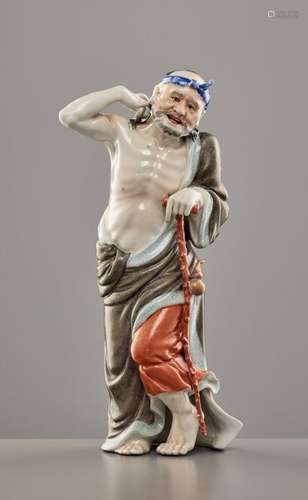 A PAINTED AND ENAMELED PORCELAIN FIGURE OF LI TIEGUAI B…