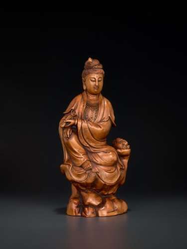 A CARVED QING DYNASTY BOXWOOD FIGURE OF GUANYIN