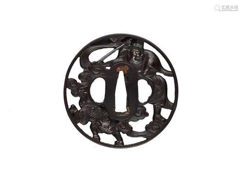 AN IRON TSUBA DEPICTING SHOKI AND ONI