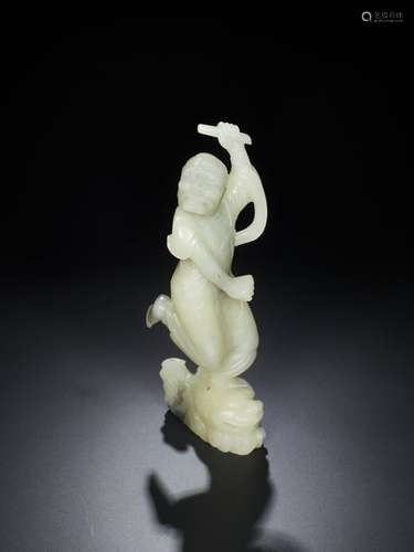 A QING DYNASTY WHITE JADE SCULPTURE OF KUIXING, THE GOD…