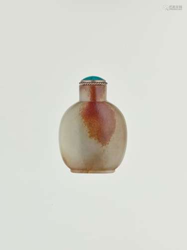 A CELADON AND RUSSET JADE SNUFF BOTTLE, 18TH CENTURY