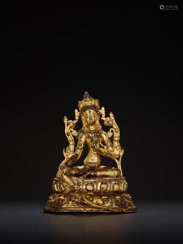 A TURQUOISE INLAID GILT BRONZE FIGURE OF A GREEN TARA, …