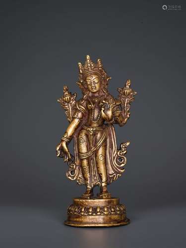 A BRONZE FIGURE OF TARA STANDING IN TRIBHANGA, TIBET, 1…