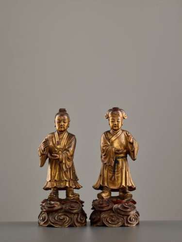 A PAIR OF WOOD AND LACQUER ‘TWIN IMMORTALS OF HARMONY’ …
