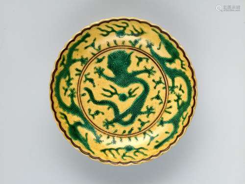 A YELLOW GROUND GREEN ENAMELLED 'DRAGON' DISH, MARK AND…