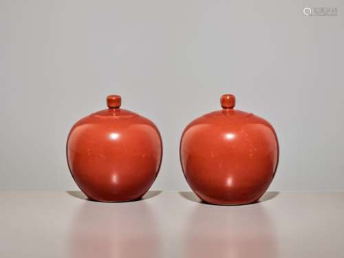 A PAIR OF CORAL GLAZED MONOCHROME JARS WITH COVERS, DAO…